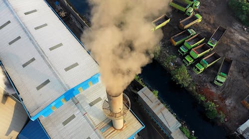 Drone Shot of Smoke Coming from Smokestack of an Industrial Building