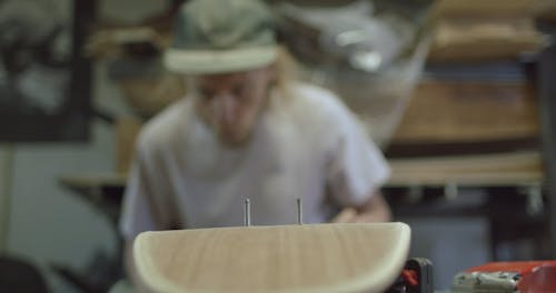 Blowing Dust From a Skateboard In Progress