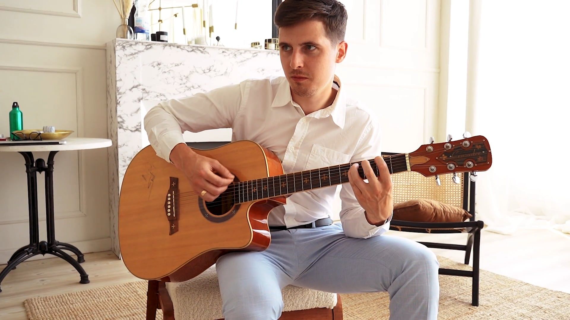 Man Sitting on Chair While Playing an Acoustic Guitar Free Stock Video ...