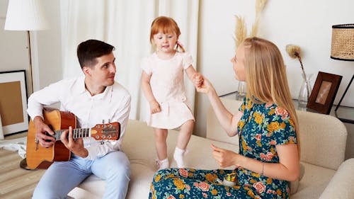 Family Having Fun Dancing and Singing