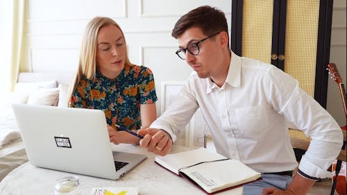 Couple Looking at the Laptop