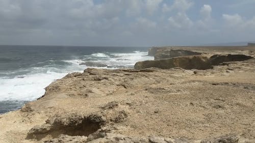 Big Waves Of The Sea Crashing The Rocky Coastline