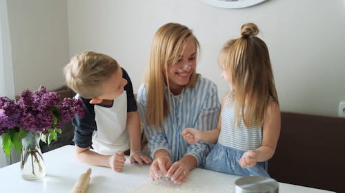 Kids Putting Flour On Mommy's Face