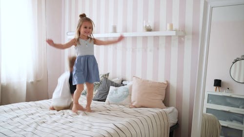 Kids Jumping On The Bed