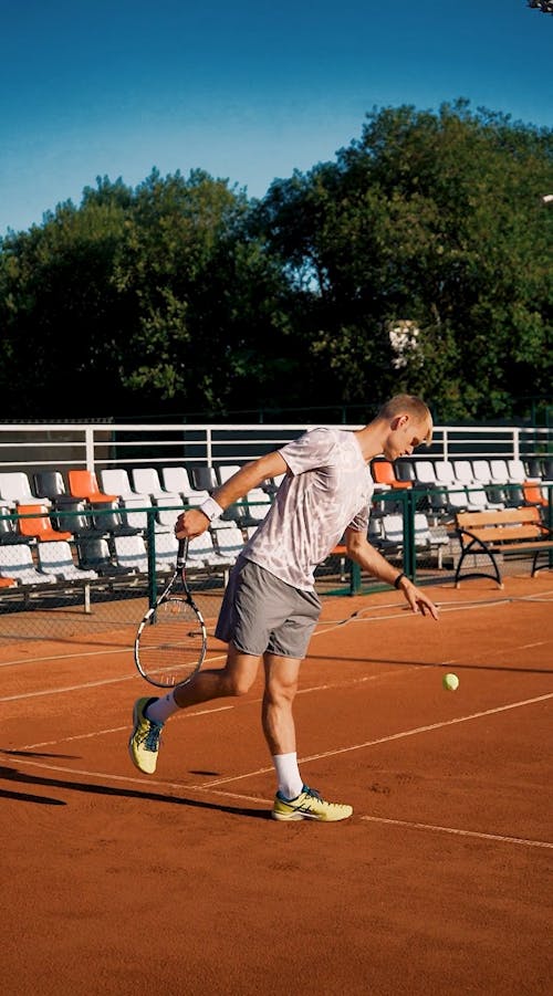 A Tennis layer Serving The Ball From The Baseline