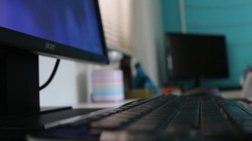 Close-Up View of Person Typing on Black Keyboard