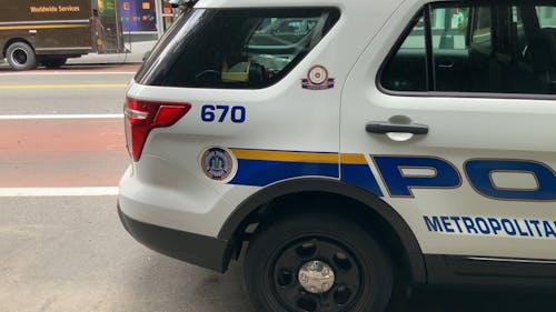 A Police Vehicle Parked In The Roadside