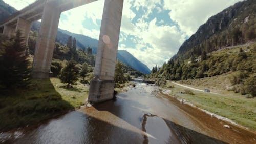 Flying A Drone Over A River Stream