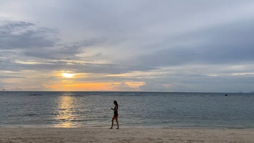 People Spending Their Time In The Beach