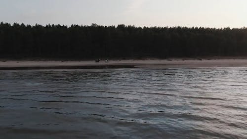 Horseback Riding Along The Seashore