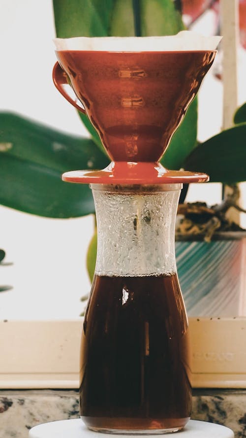 Coffee Making Using Filtered Ceramic Cup Over A Container