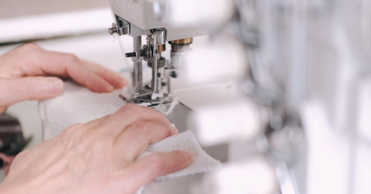 Person Using Stitching Machine A Person Stitching a Cloth Using a Sewing Machine Free Stock Video ...