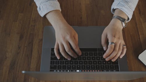 Person Typing on a Laptop