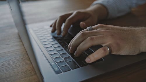 Person Typing on a Laptop