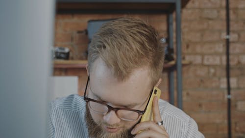Man Having a Conversation on the Phone