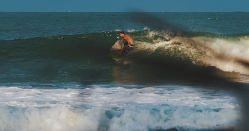 Person Surfing on the Waves