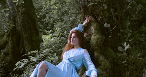 Woman Posing and Leaning on a Tree