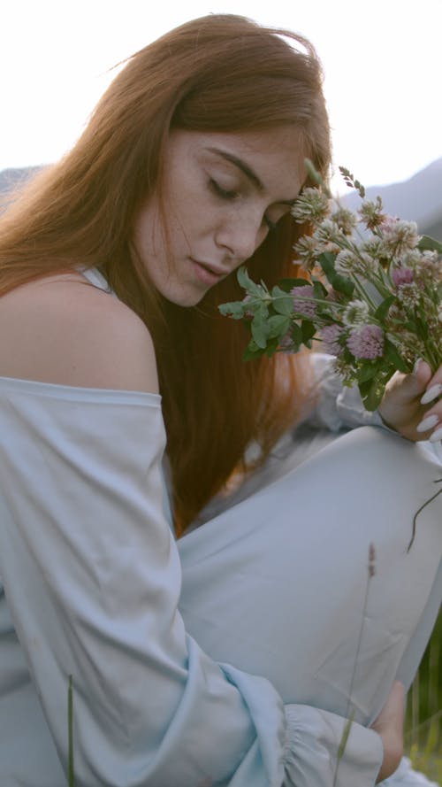 Woman Holding a Flowers