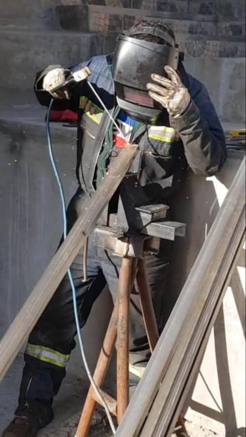 Man Welding a Steel