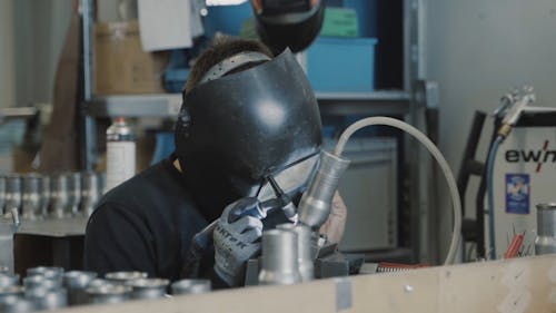 Worker Welding Steel