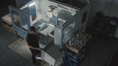 High Angle Shot of a Man Using a Milling Machine