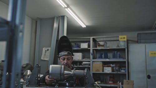 Worker Welding Metal