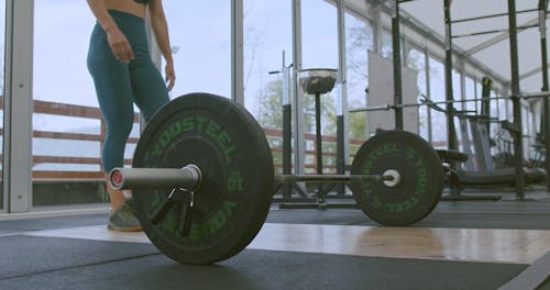 Woman Lifting a Barbell