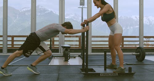 Couple Working Out at the Gym