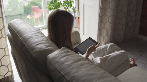 Person Using Cellphone at Home