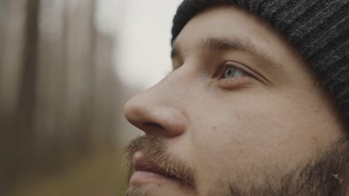 Close-Up View of a Man's Face Wearing Knit Cap