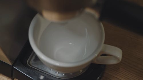 Pouring Coffee from a Coffee Maker