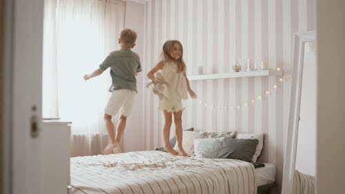 Kids Jumping on the Bed