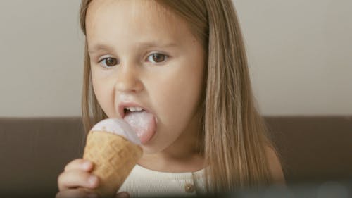 Young Girl Eating an Ice Cream