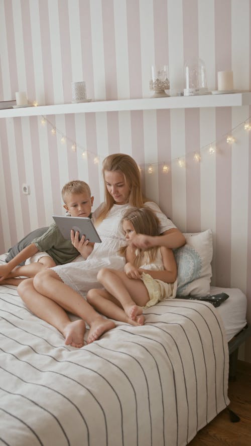 Woman with Children Watching on Ipad