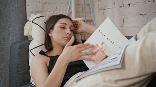 Stressed Woman Trying to Relax on a Couch