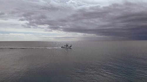 A Fishing Boat Traveling on the Sea