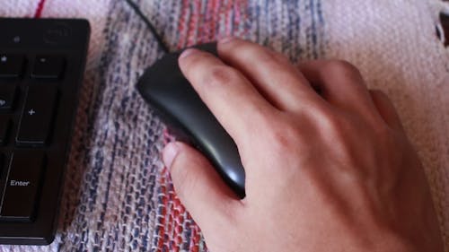 Close-Up View of a Person Using a Mouse