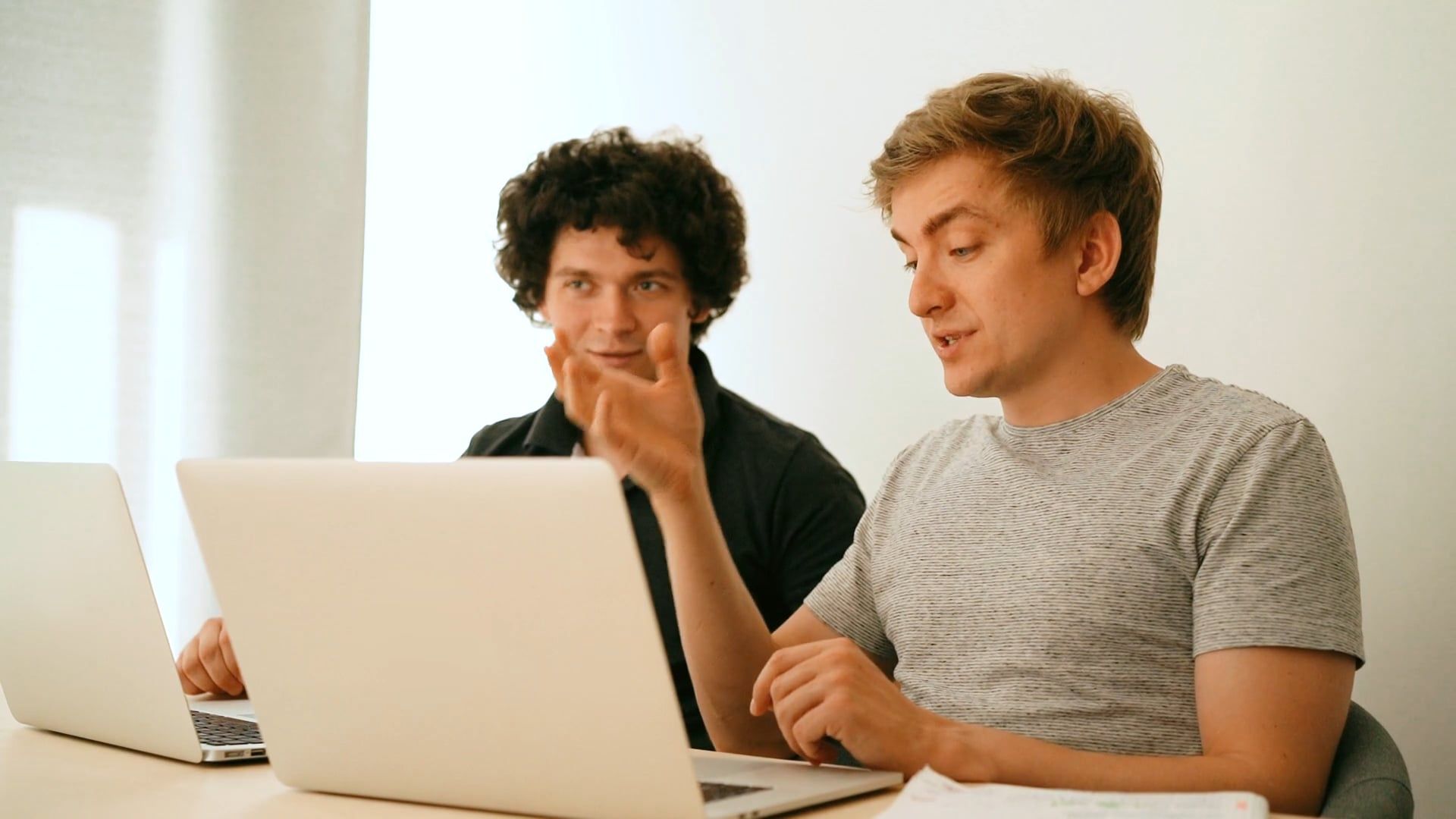 Men Having Conversation in front of their Laptops · Free Stock Video