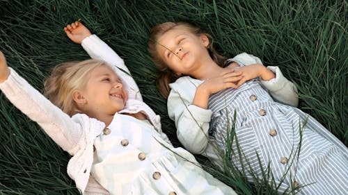 Kids Laying on the Grass