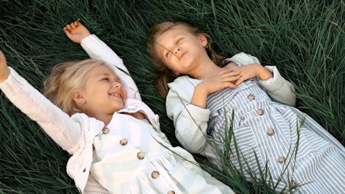 Kids Laying on the Grass