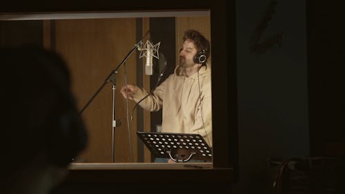A Man Singing Inside the Music Studio
