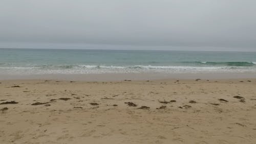 Flying A Drone Over The Beach Shore