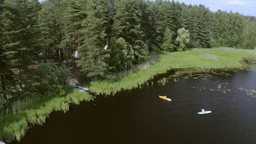 People Riding a Kayak at the Lake