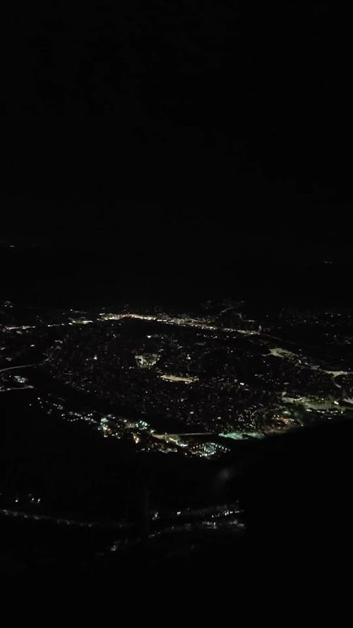 Airplane Landing at the Airport at the Night Time