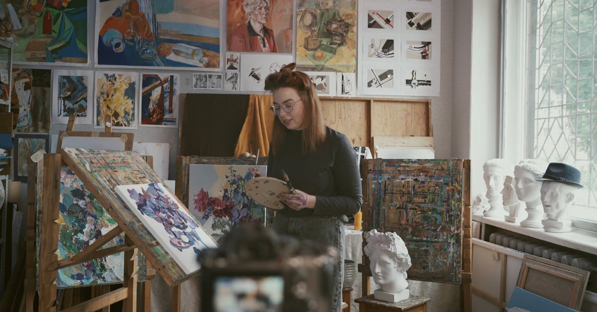 Person Painting an Artwork While Recording · Free Stock Video