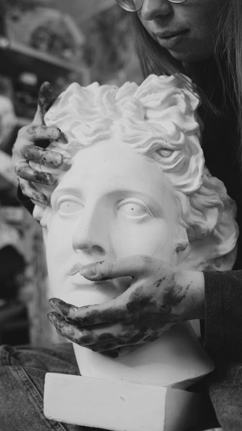 A Woman Touching a Plaster Sculpture
