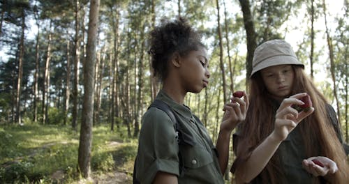 Girls Holding Strawberries