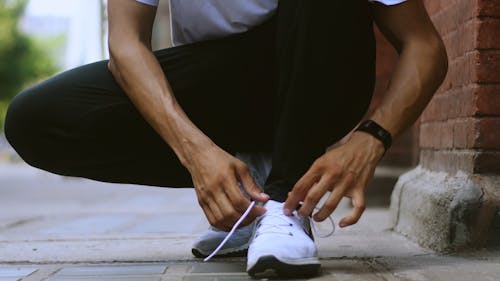 Person Tying His Shoelace