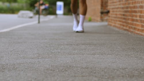 Person Walking on the Sidewalk