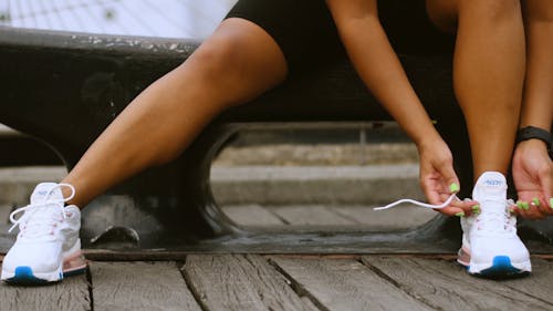 Person Tying Her Shoelace